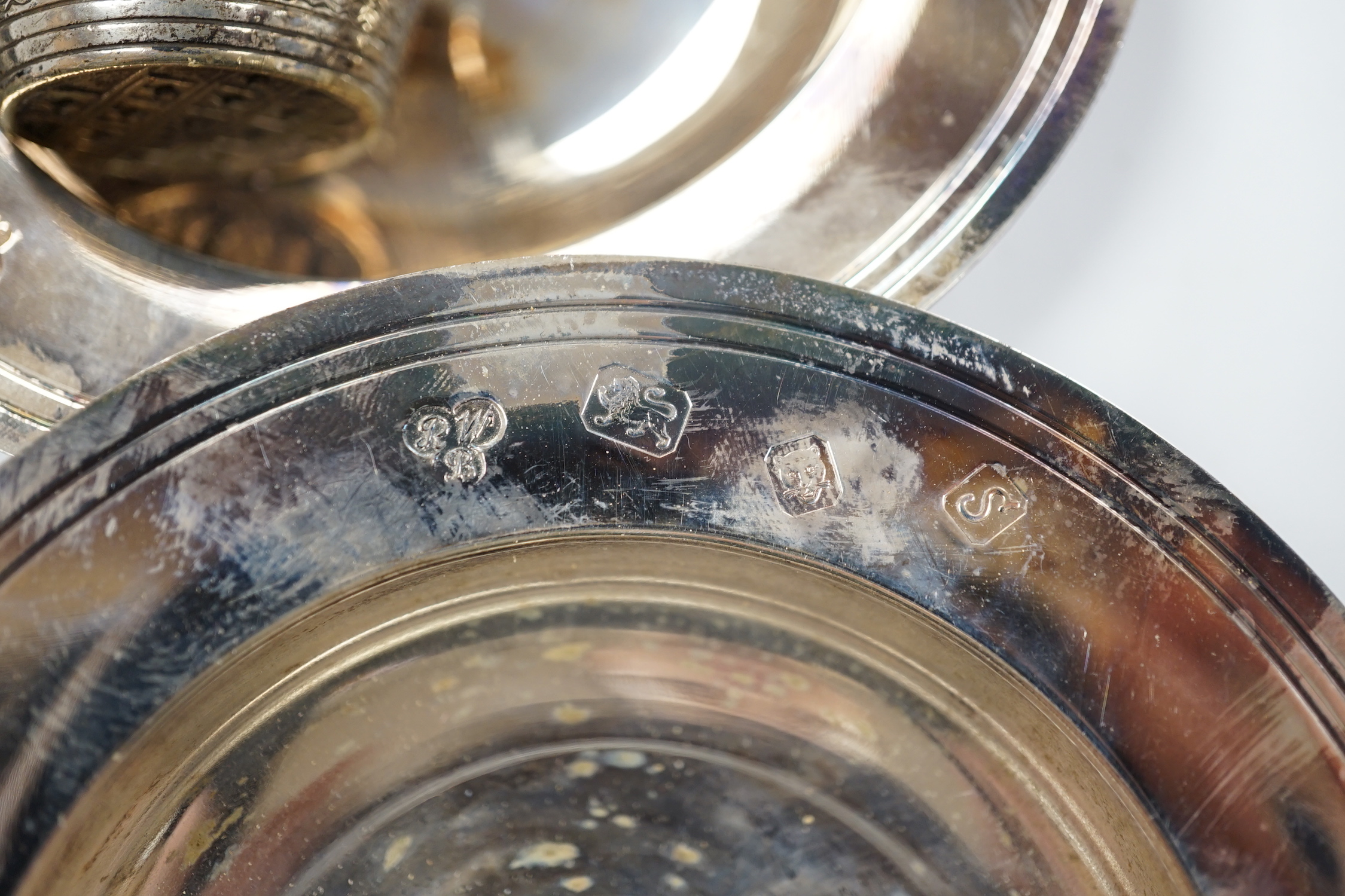 A quantity of silver items including a late Victorian repousse photograph frame, William Comyns, London, 1899, 20cm, three Georgian pepperettes, pair of small Armada dishes, quaich, vest case, menu holder, basting spoons